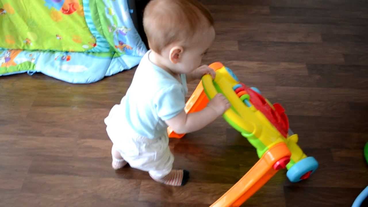 baby walking with push walker